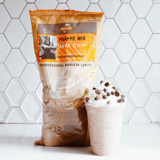 Bag of Java Chip Frappe Mix powder next to a made chocolate chip drink blended with ice and topped with chocolate morsels.