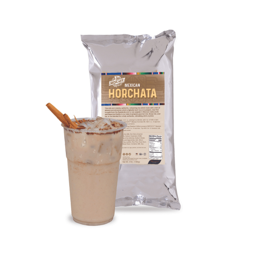 Horchata drink served with a cinnamon stick and cinnamon rim next to a bag of Horchata Mexican Agua fresca beverahe mix from Mocafe.