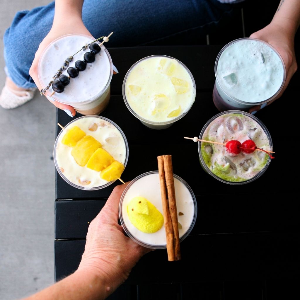 6 Spring Layered Drink Ideas for Coffee Shops on a black table